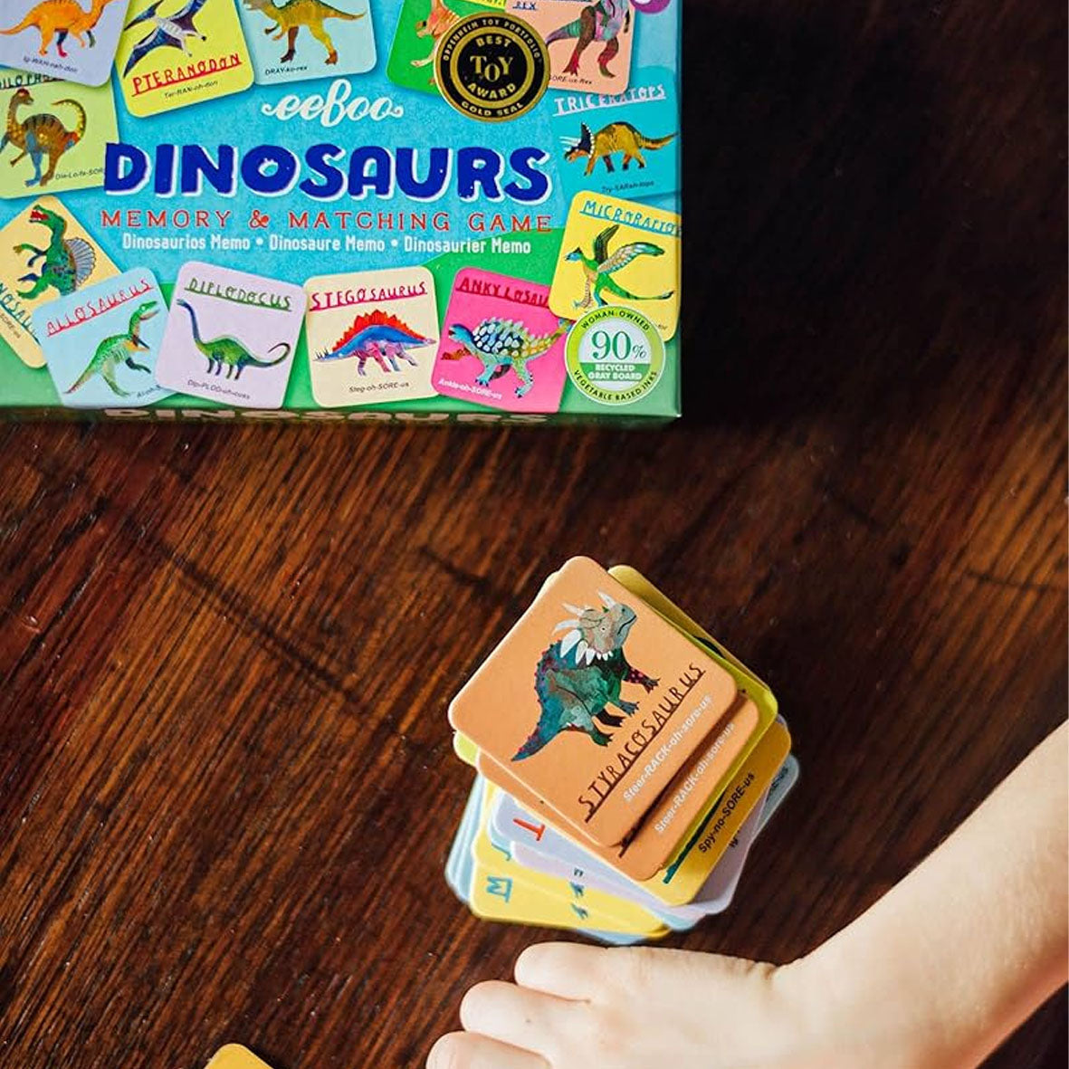 a stack of tiles and the box from eeboo toys memory and matching dinosaurs childrens game
