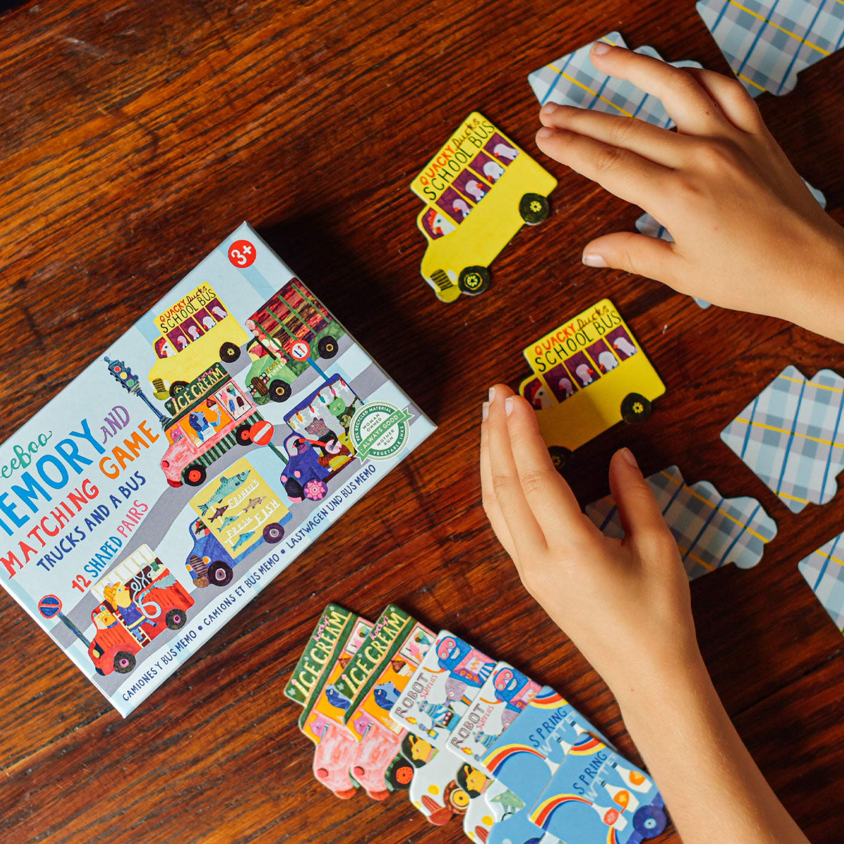 childrens memory and matching game with a colourful box and truck and bus shaped pieces for children 3 years and older