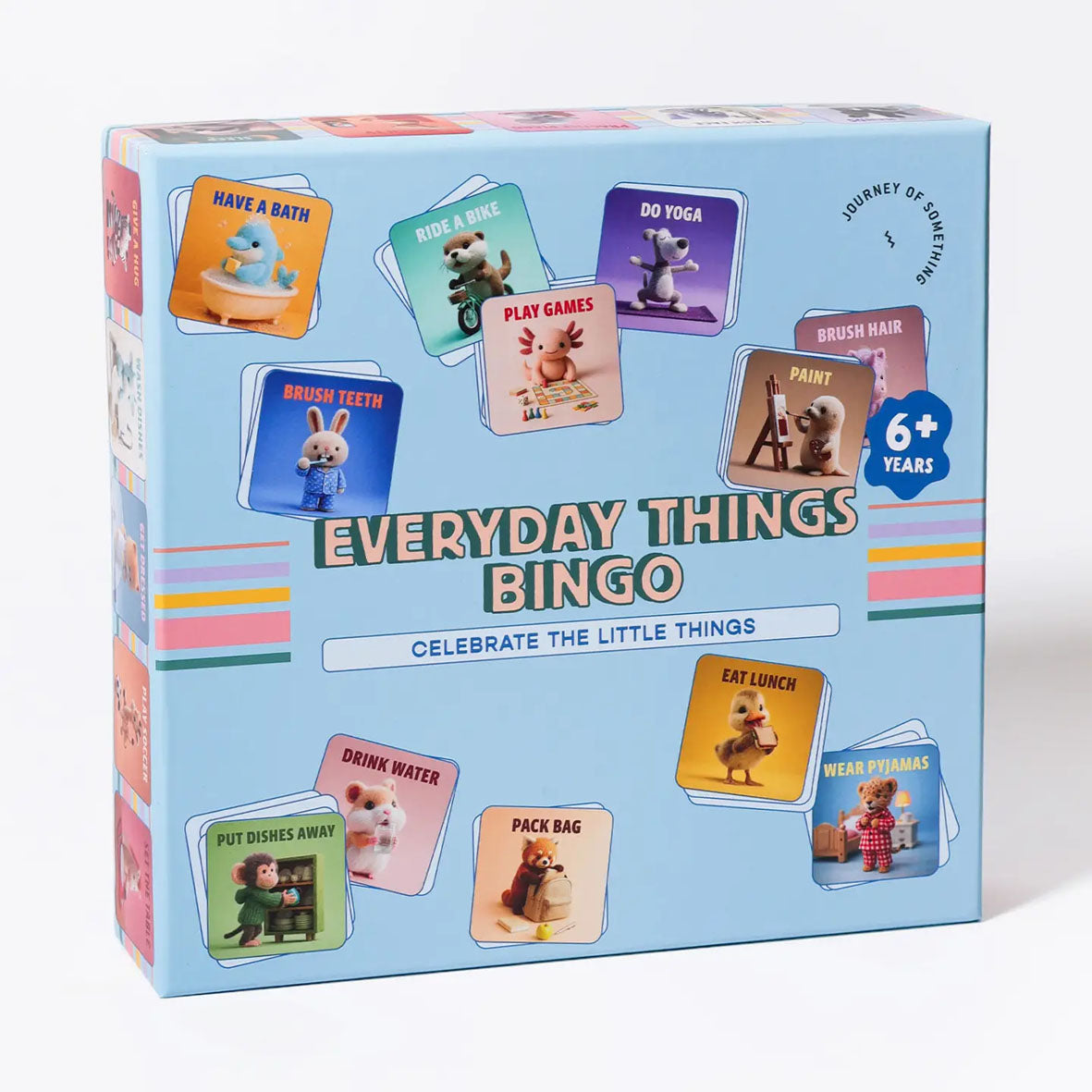 The board game box for 'Everyday Things Bingo' by Journey of Something, featuring a light blue background with colourful illustrated cards and a blue '6+ Years' badge.