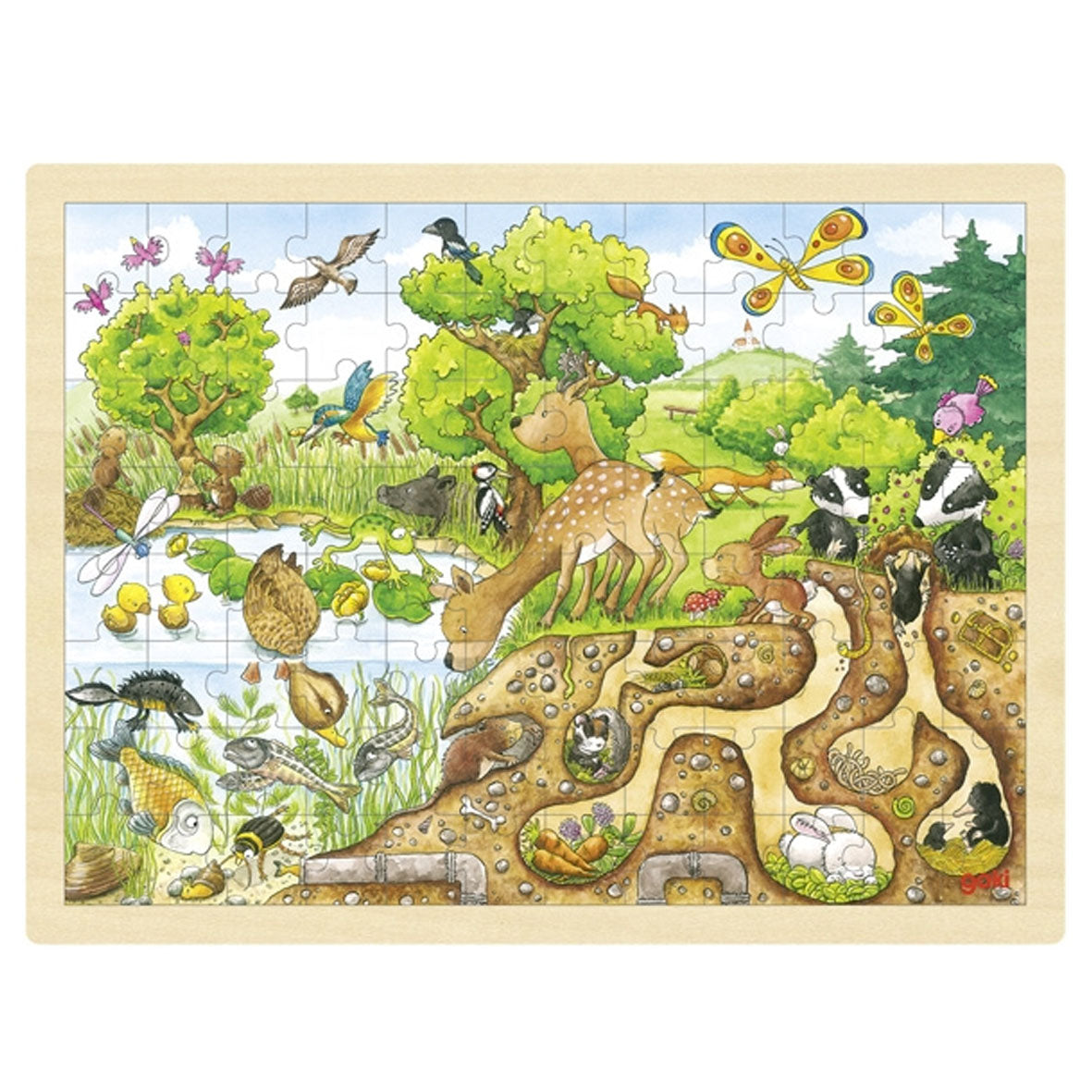a wooden tray puzzle with 96 pieces featuring animals above and below the land by a pond by goki toys